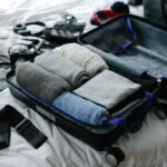 Carry-on suitcase packed with essential travel items for a stress-free trip