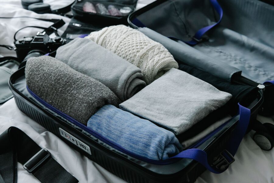 Carry-on suitcase packed with essential travel items for a stress-free trip