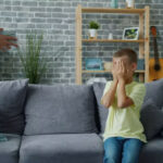 Parent setting a healthy boundary while talking calmly with their child
