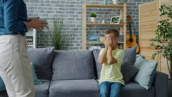 Parent setting a healthy boundary while talking calmly with their child